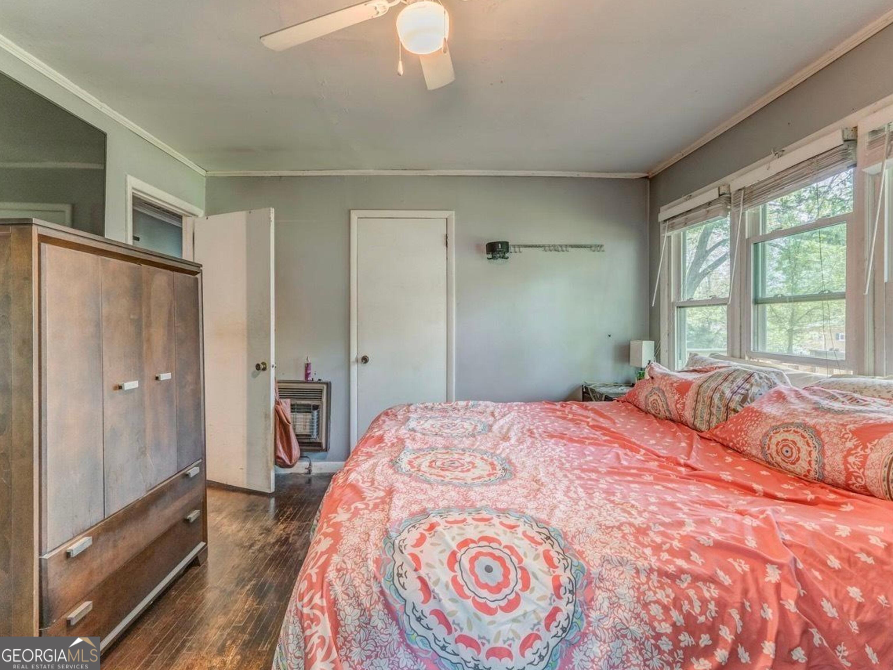 455 Bell Street Menlo, GA 30731 - Photo 8 of 18 a bedroom with a bed and a large mirror next to a window