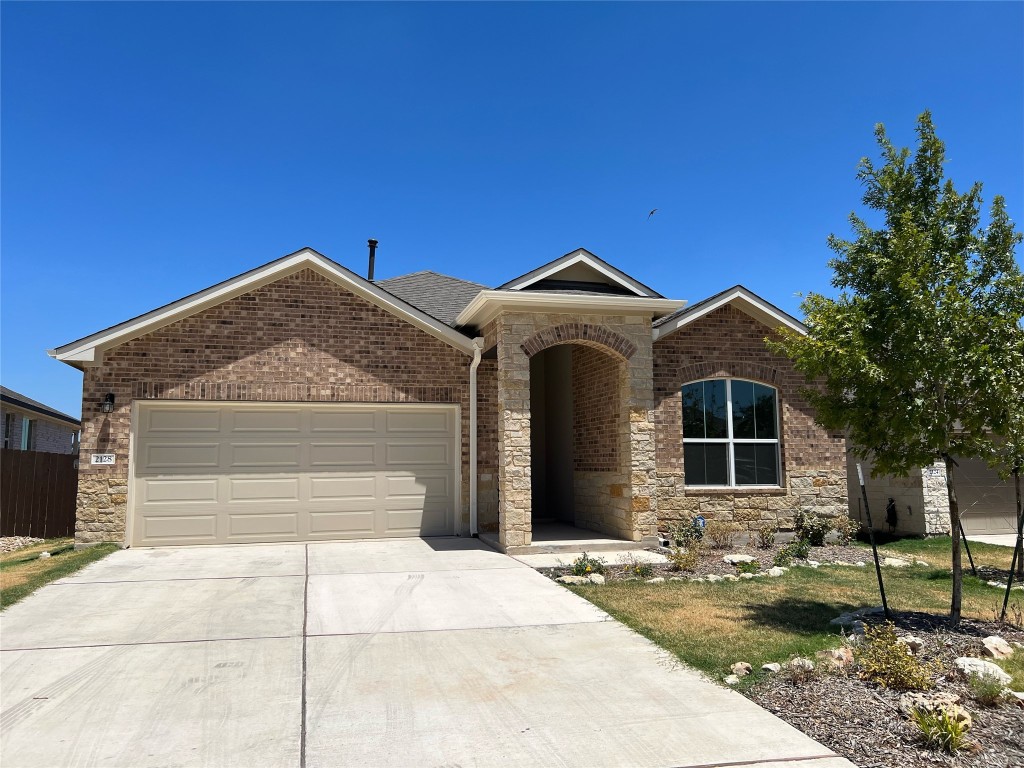 2128 Centerline Lane Georgetown, TX 78628 - Photo 1 of 1 a front view of a house with garden