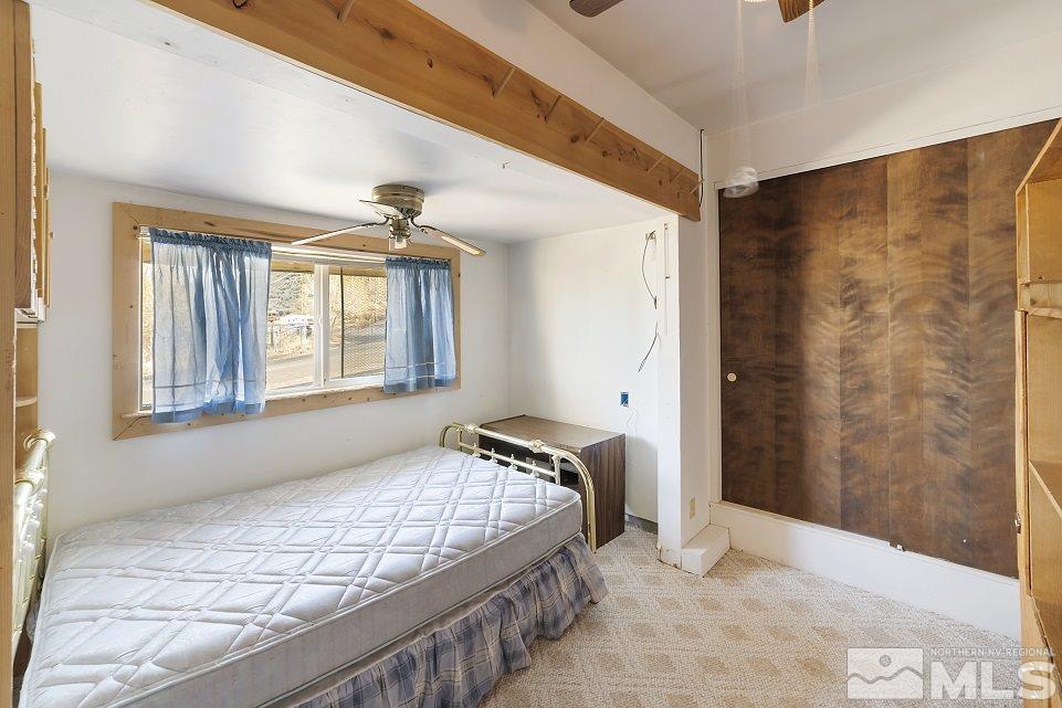 8780 Paloma Way Reno, NV 89506 - Photo 13 of 22 a bedroom with a bed and a window