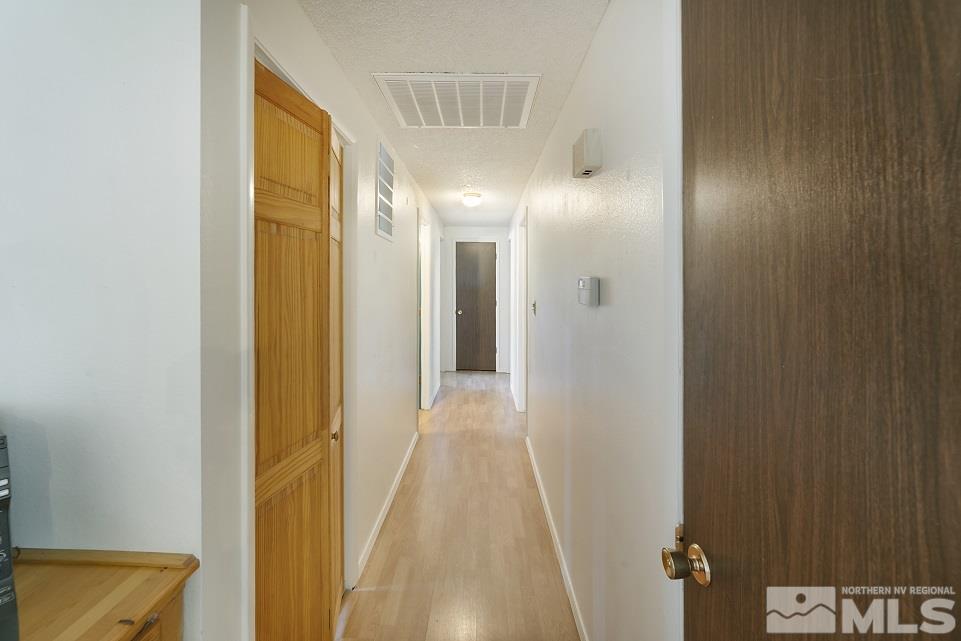 8780 Paloma Way Reno, NV 89506 - Photo 14 of 22 a view of a bathroom from a hallway