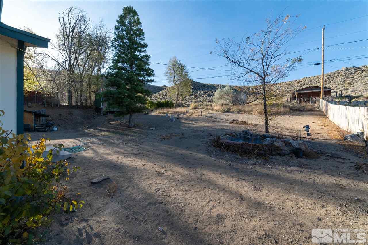 8780 Paloma Way Reno, NV 89506 - Photo 18 of 22 a view of a yard with car parked
