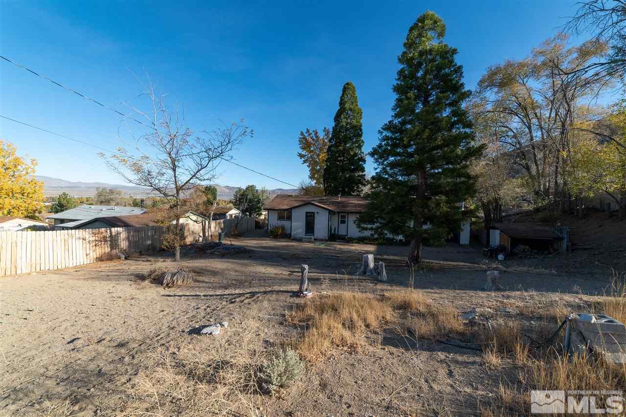 8780 Paloma Way Reno, NV 89506 - Photo 20 of 22 a view of a yard covered with snow in the background
