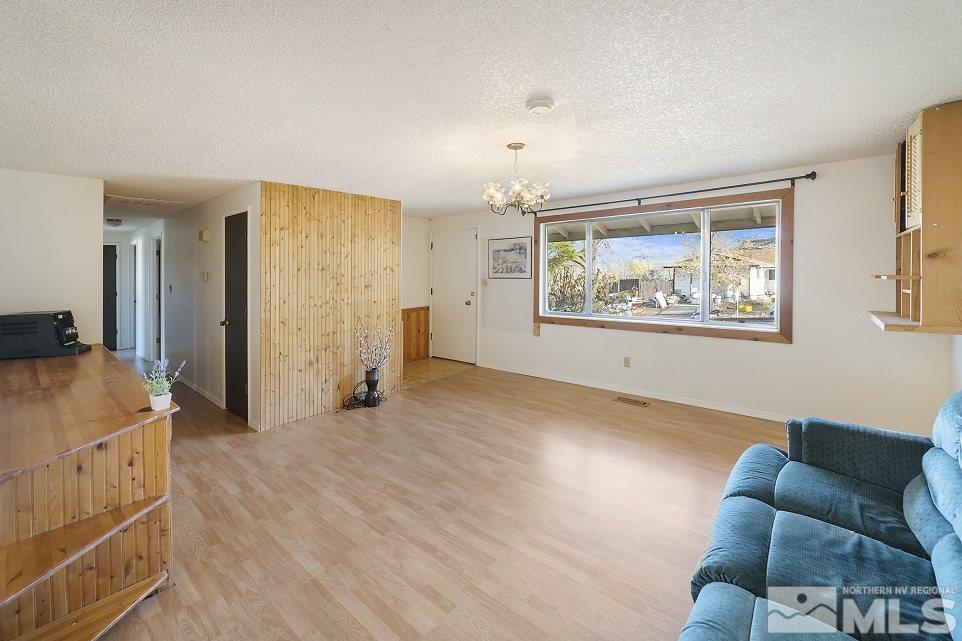 8780 Paloma Way Reno, NV 89506 - Photo 5 of 22 a view of livingroom with furniture and window