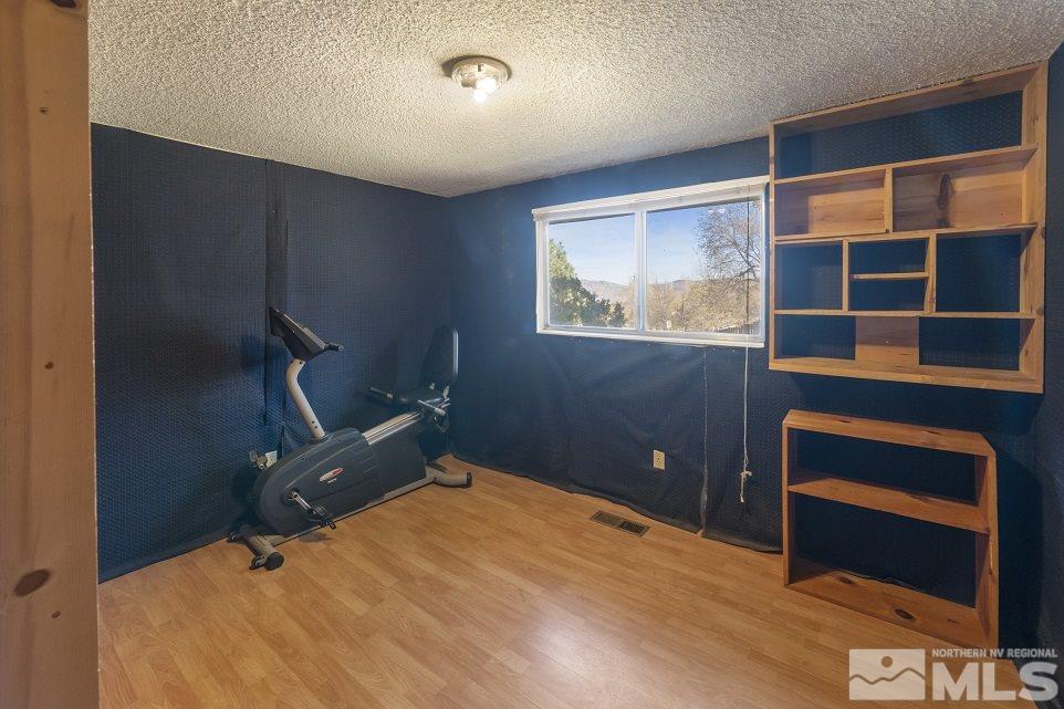 8780 Paloma Way Reno, NV 89506 - Photo 10 of 22 a bedroom with a bed and furniture