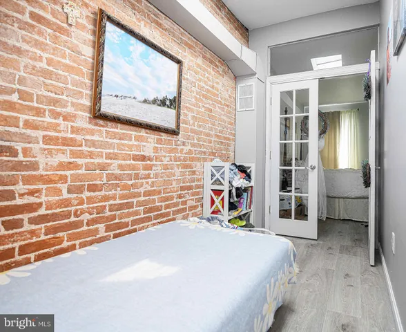 a bedroom with a bed and a view of bathroom