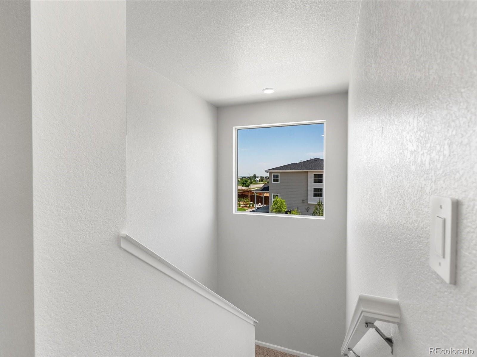 7300 West 27th St Road Greeley, CO 80634 - Photo 16 of 39 a hallway with a painting on the wall