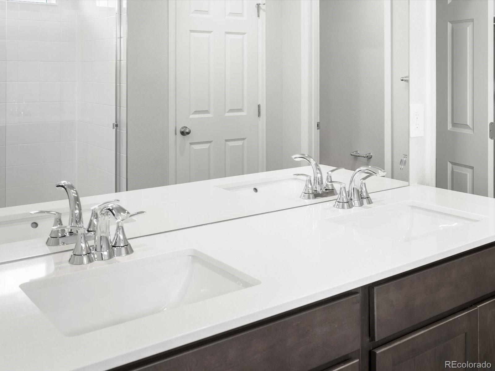 7300 West 27th St Road Greeley, CO 80634 - Photo 21 of 39 a bathroom with a sink and a mirror