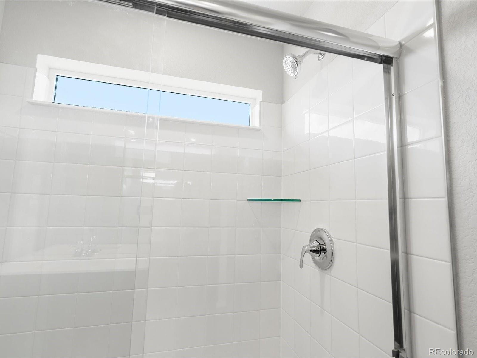 7300 West 27th St Road Greeley, CO 80634 - Photo 22 of 39 a bathroom with a shower