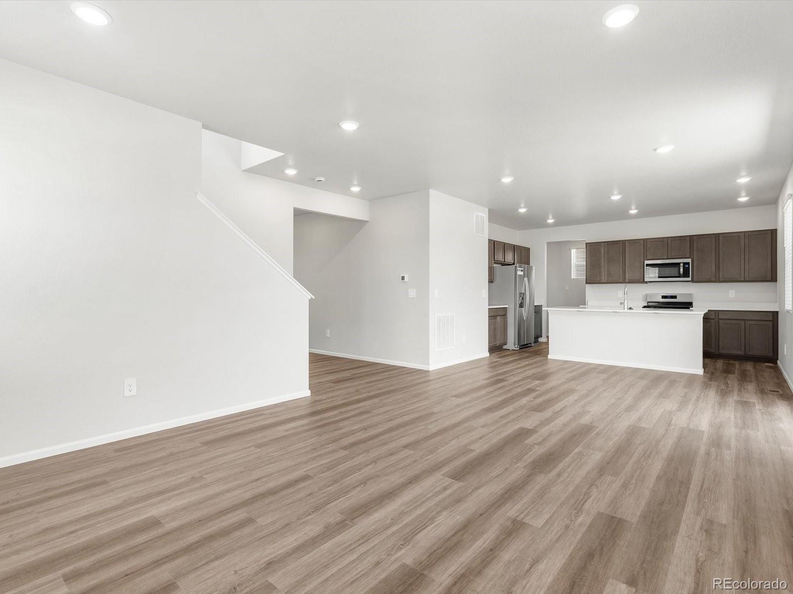 7300 West 27th St Road Greeley, CO 80634 - Photo 8 of 39 a view of kitchen with wooden floor