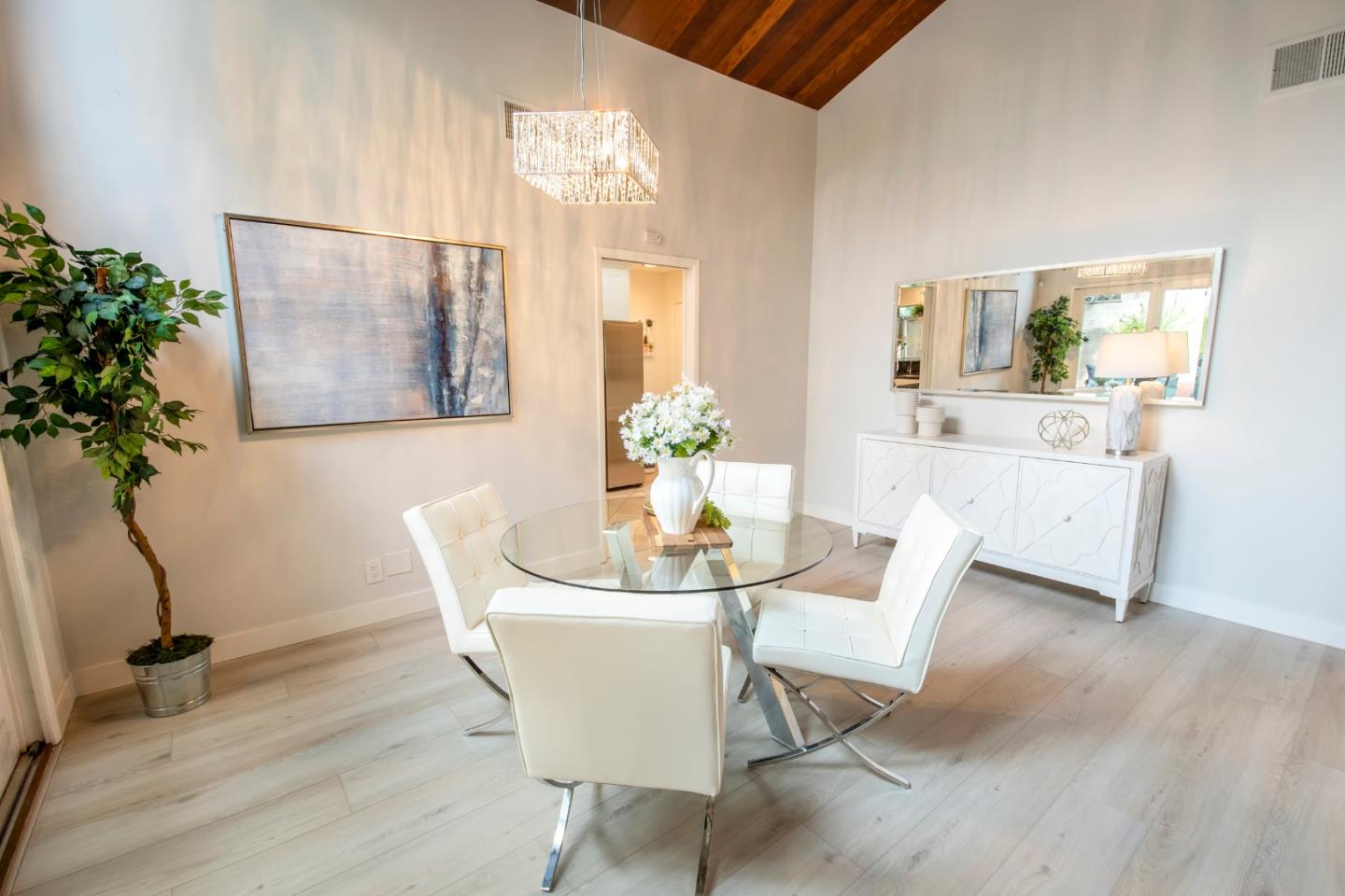 22991 Longdown Road Cupertino, CA 95014 - Photo 12 of 31 a dining room with furniture and wooden floor