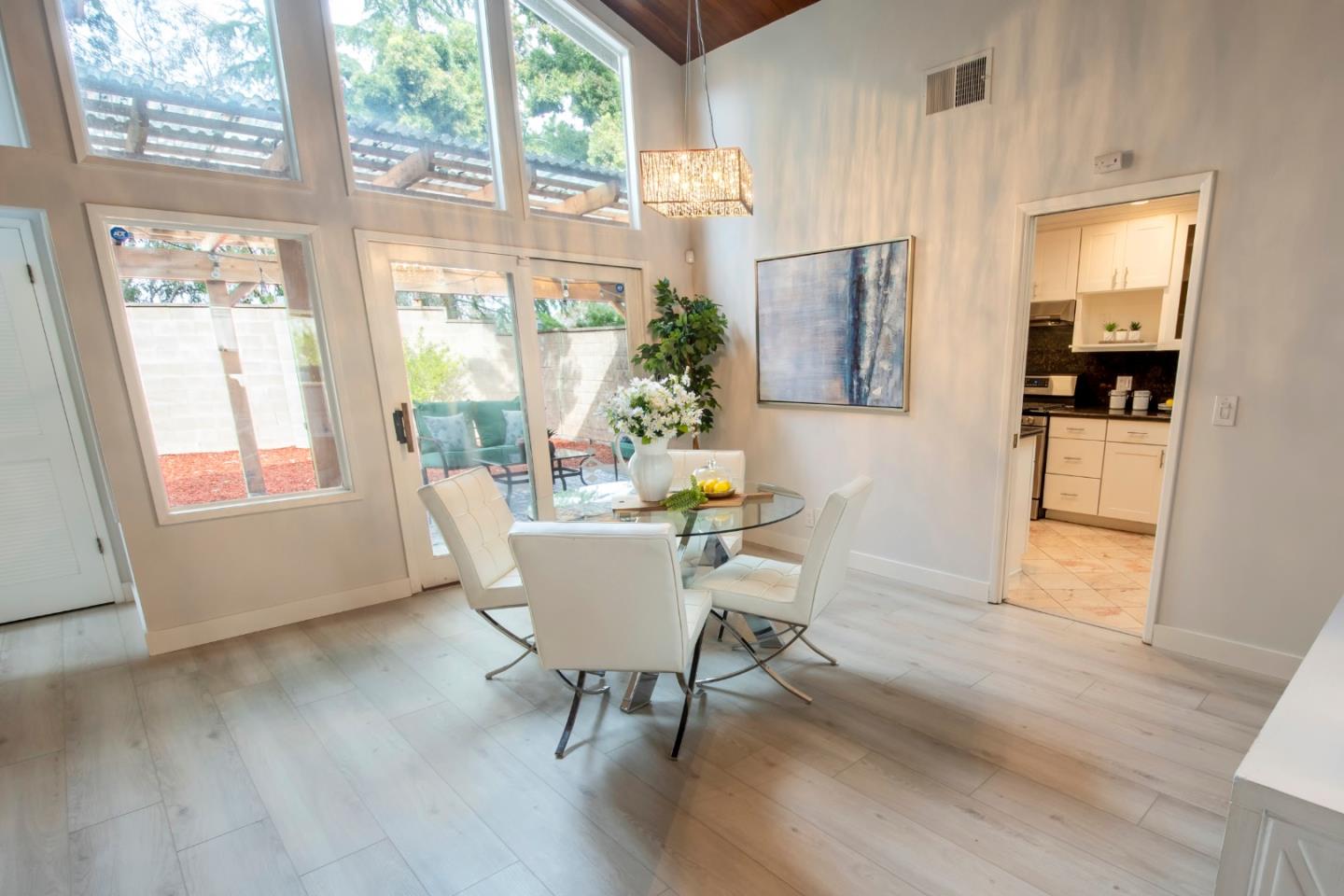 22991 Longdown Road Cupertino, CA 95014 - Photo 13 of 31 a dining room with furniture window wooden floor