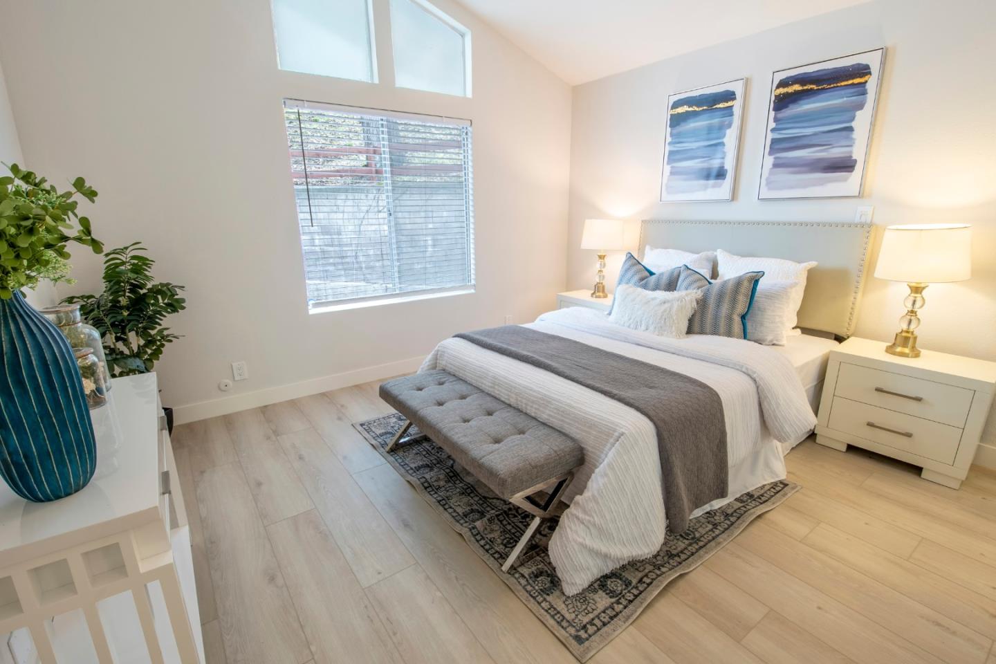 22991 Longdown Road Cupertino, CA 95014 - Photo 16 of 31 a bed sitting in a bedroom next to a window