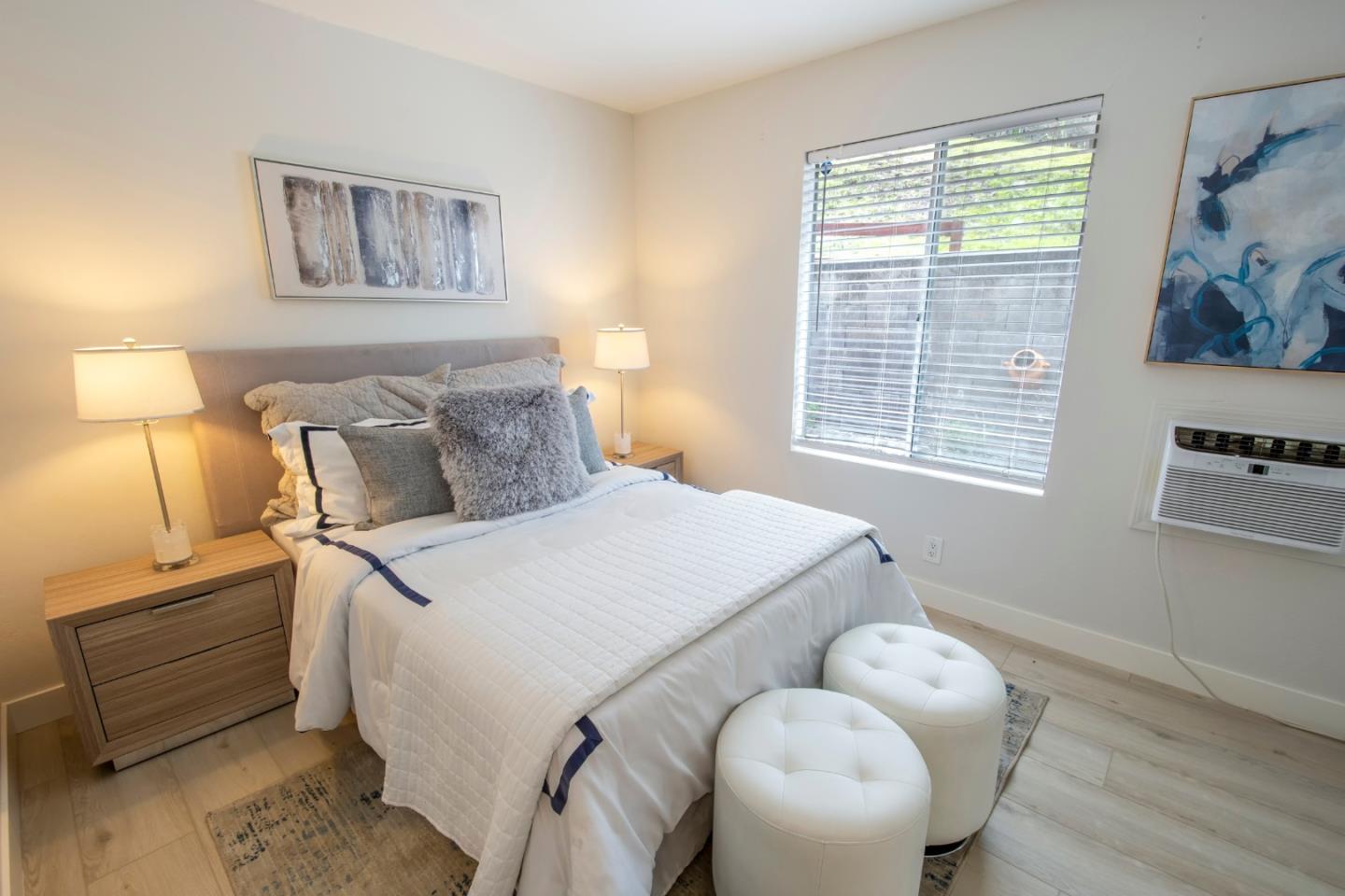 22991 Longdown Road Cupertino, CA 95014 - Photo 18 of 31 a bedroom with a bed and a window