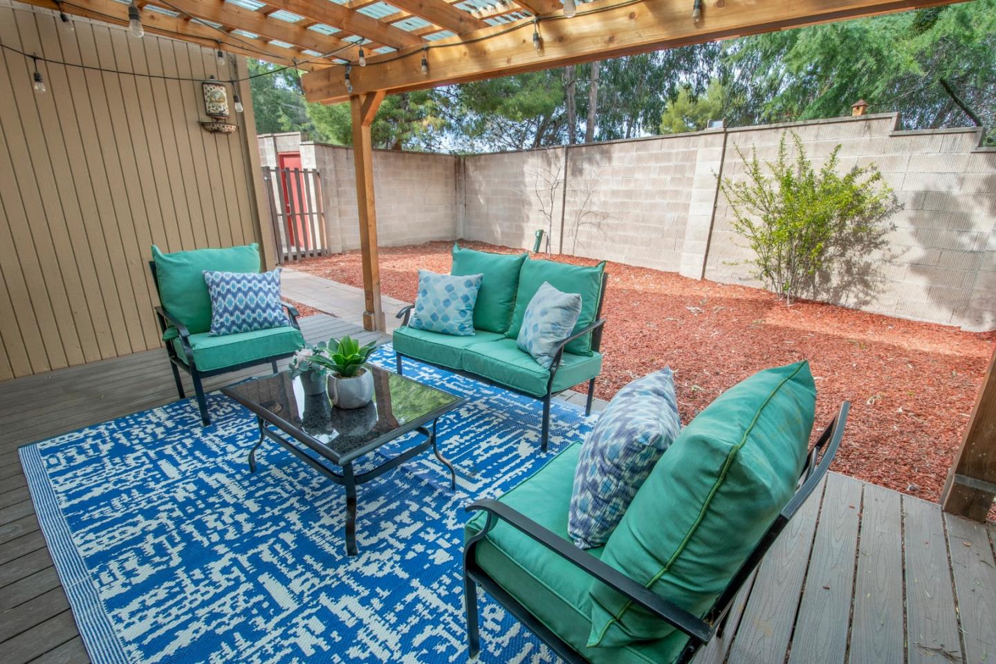 22991 Longdown Road Cupertino, CA 95014 - Photo 27 of 31 a view of a backyard with furniture and a garden
