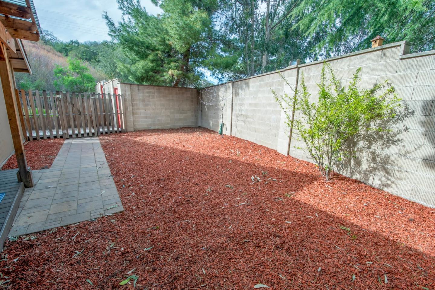 22991 Longdown Road Cupertino, CA 95014 - Photo 28 of 31 a backyard of a house with an outdoor space