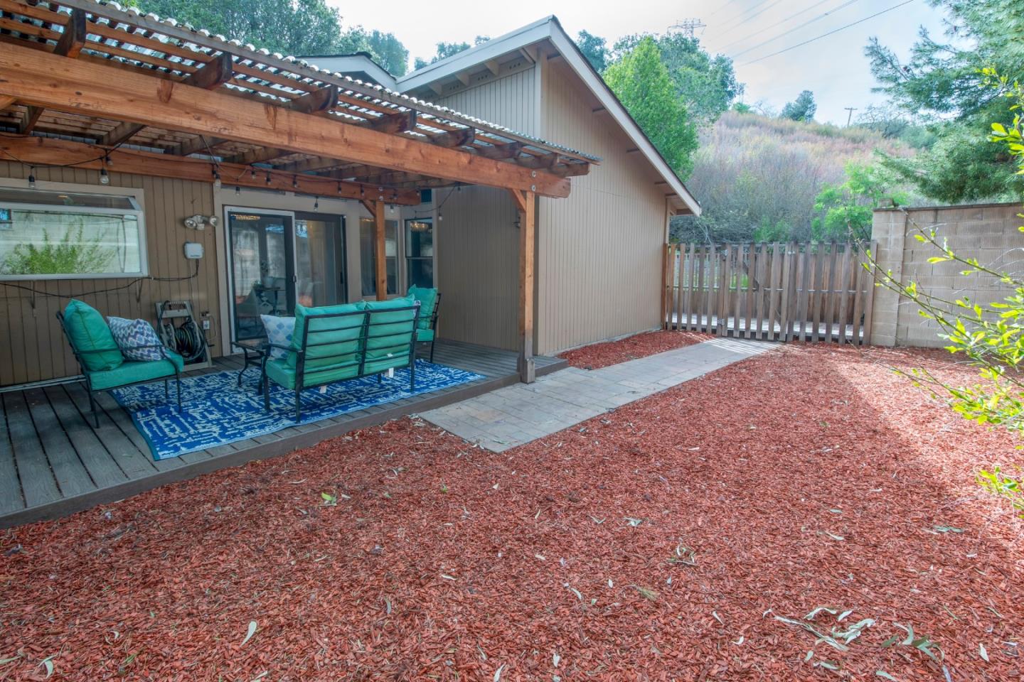22991 Longdown Road Cupertino, CA 95014 - Photo 29 of 31 a view of backyard of house with wooden fence