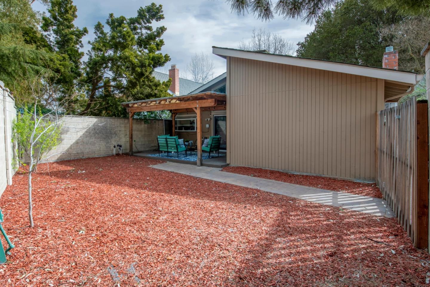 22991 Longdown Road Cupertino, CA 95014 - Photo 30 of 31 a view of a backyard with a barn and a large tree