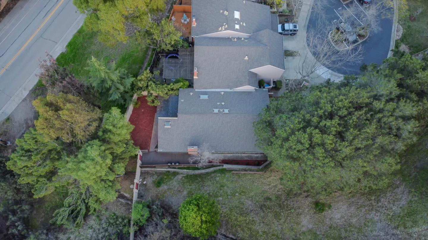 22991 Longdown Road Cupertino, CA 95014 - Photo 3 of 31 an aerial view of a house with garden space and street view