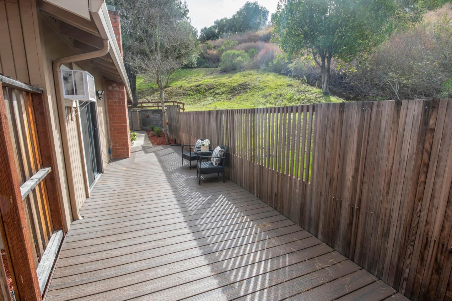 22991 Longdown Road Cupertino, CA 95014 - Photo 6 of 31 a view of balcony with wooden floor and chair