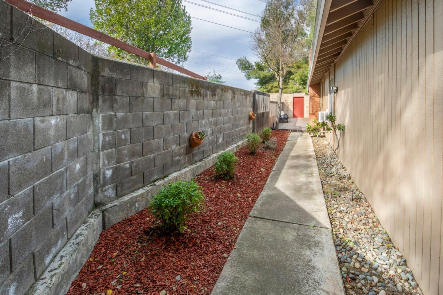 22991 Longdown Road Cupertino, CA 95014 - Photo 7 of 31 a pathway of a house with a yard