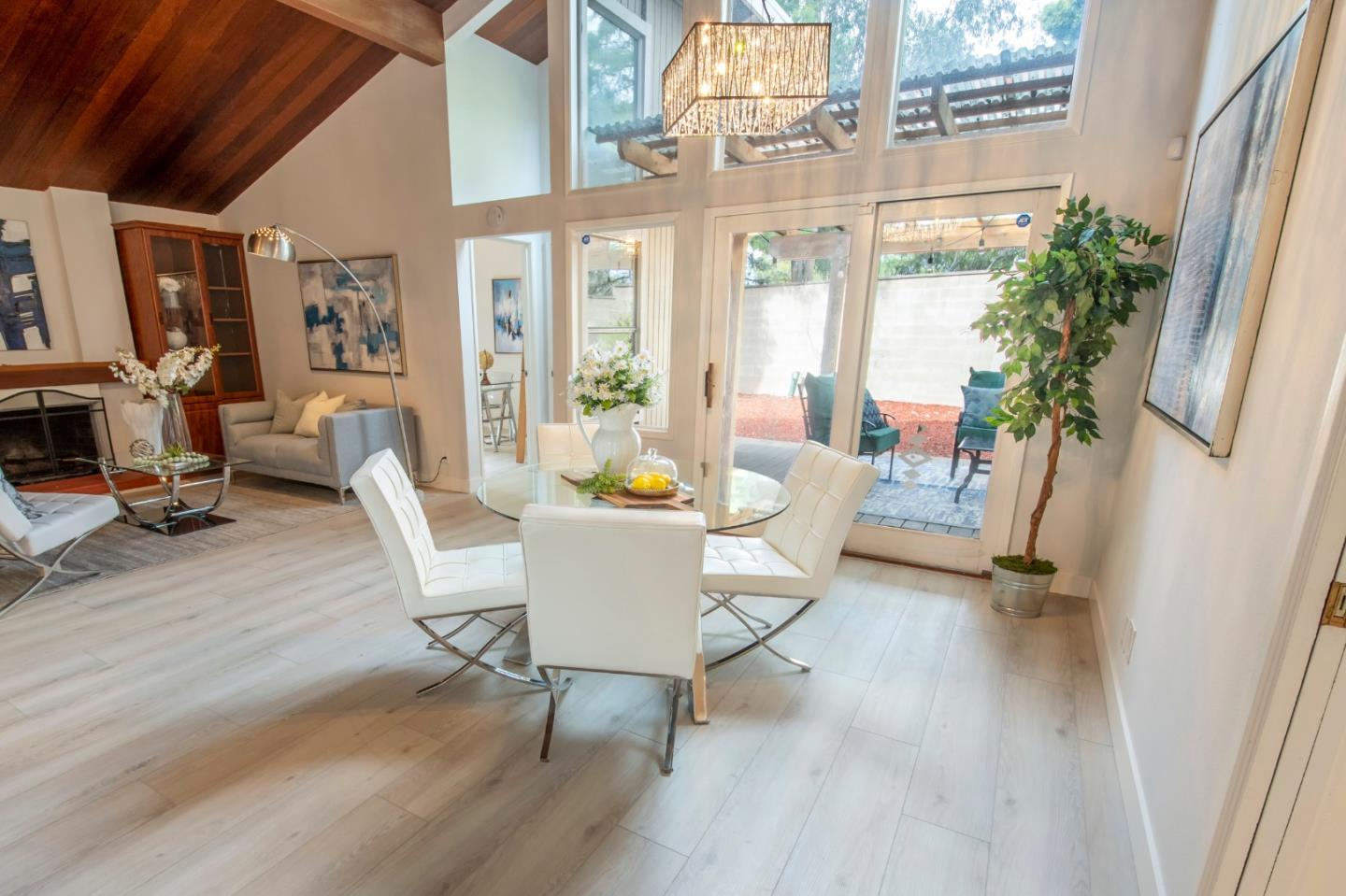 22991 Longdown Road Cupertino, CA 95014 - Photo 10 of 31 a view of a dining room with furniture window and wooden floor