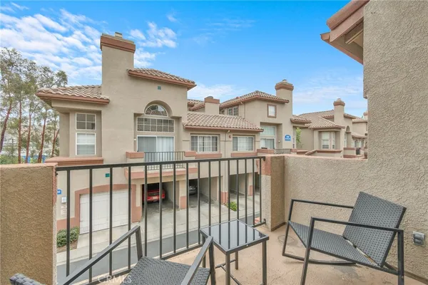 a view of a brick building from a balcony