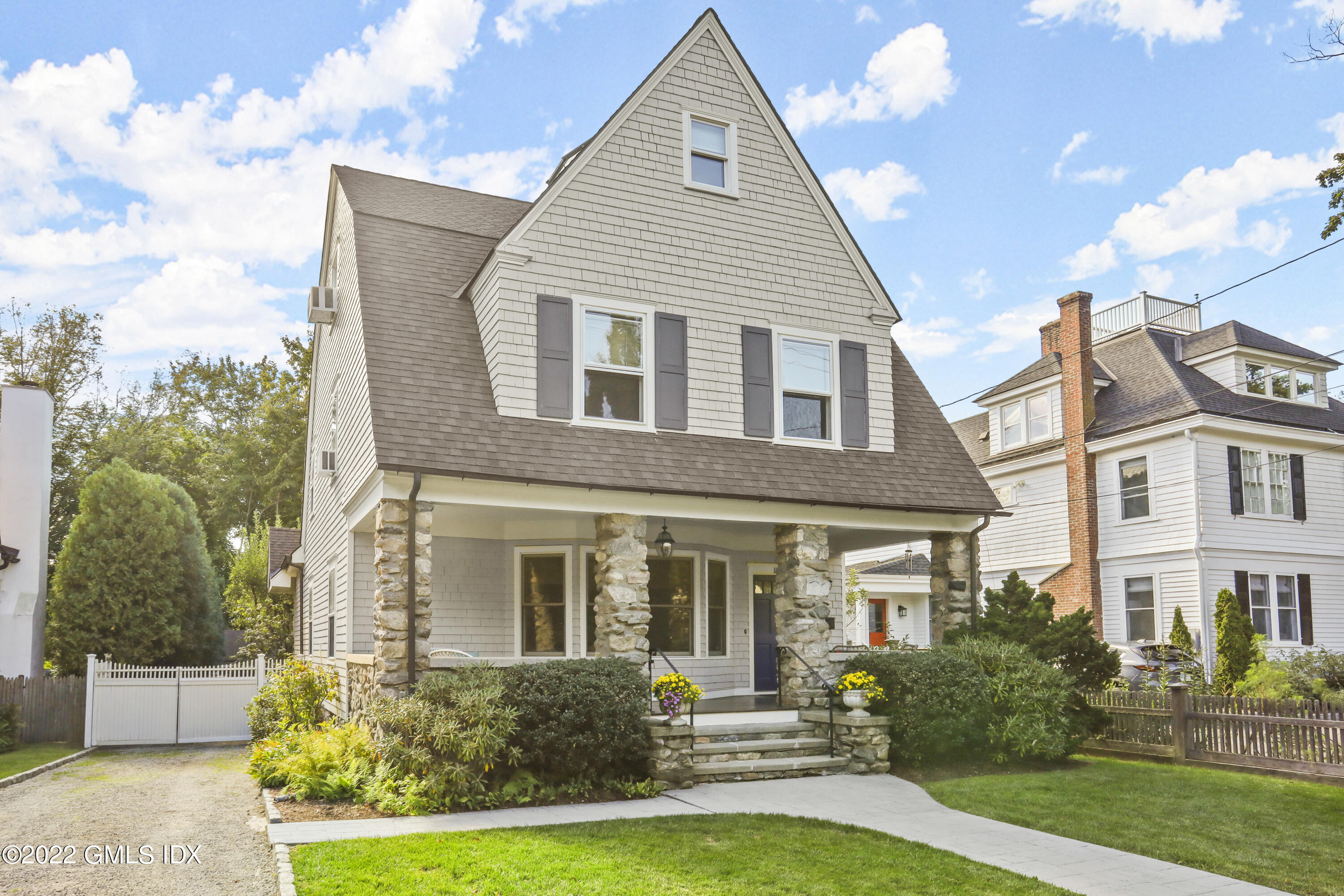 a front view of a house with garden