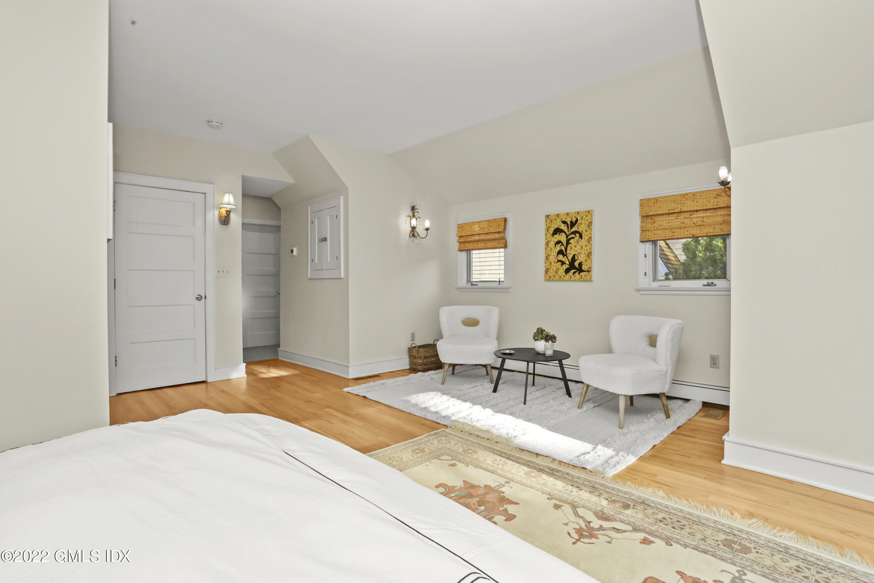 12 Maher Avenue Greenwich, CT 06830 - Photo 13 of 34 a bedroom with a bed a table and chair