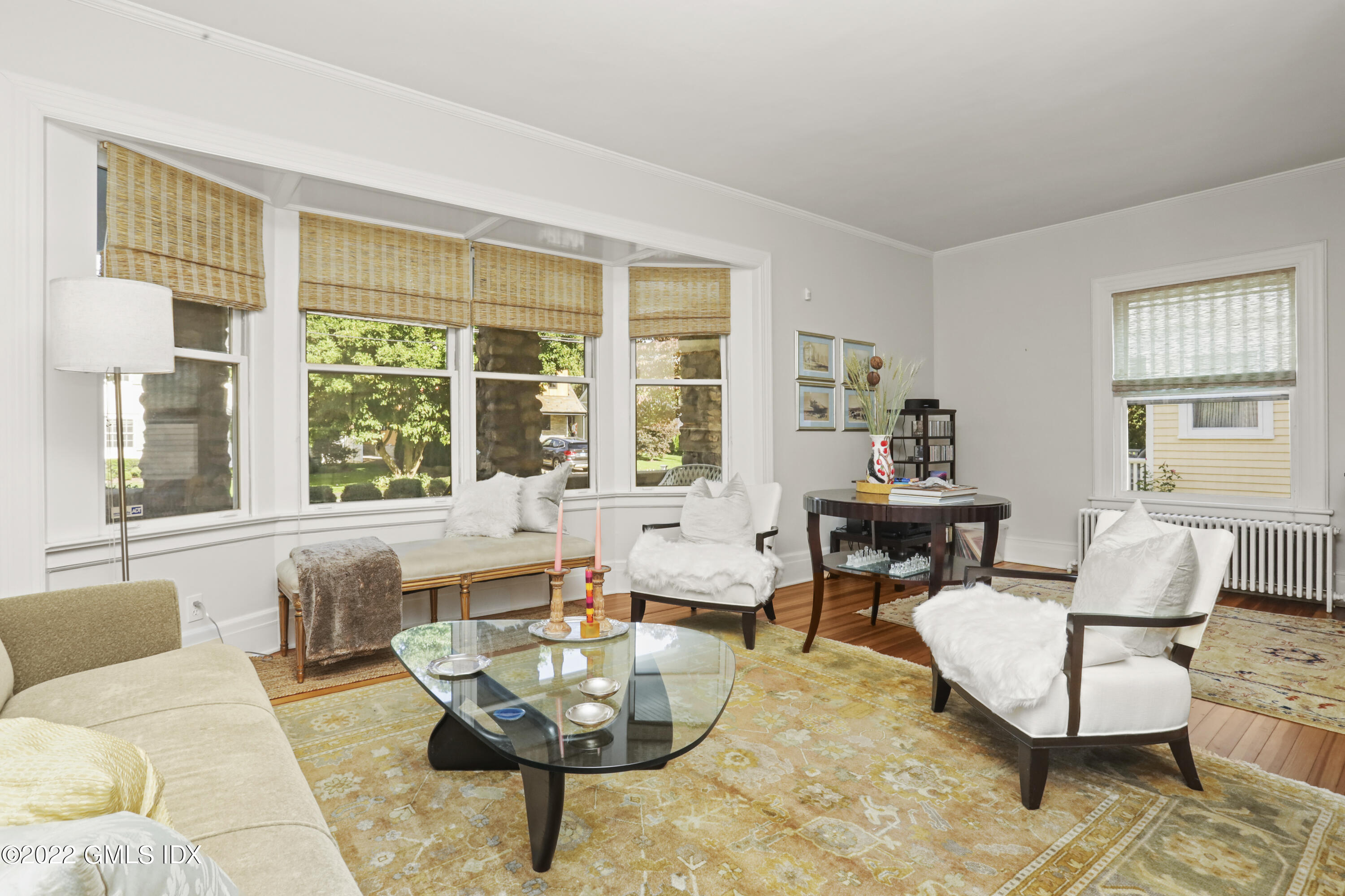 12 Maher Avenue Greenwich, CT 06830 - Photo 2 of 34 a living room with fireplace furniture and a large window