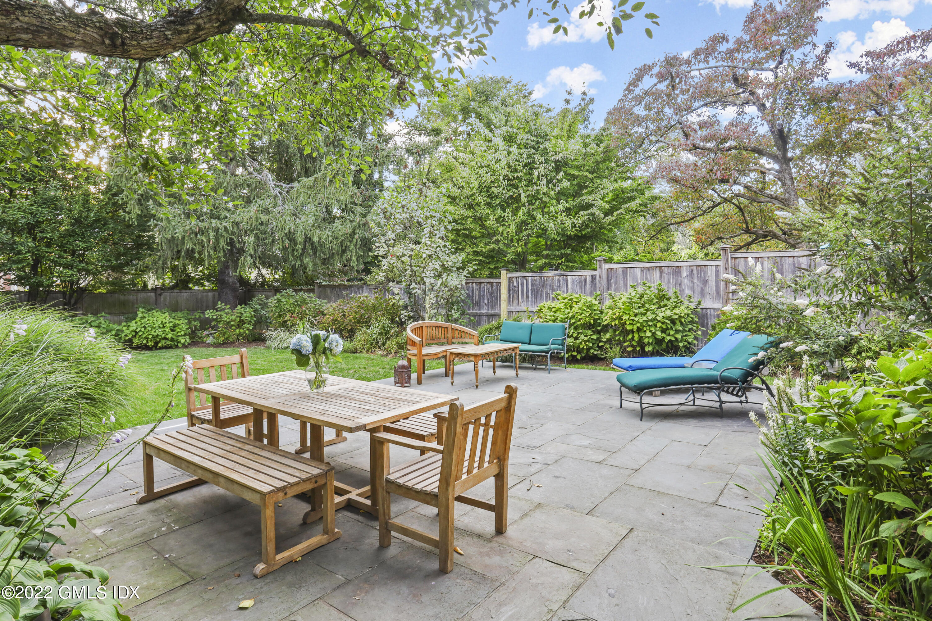 12 Maher Avenue Greenwich, CT 06830 - Photo 25 of 34 a backyard of a house with outdoor seating