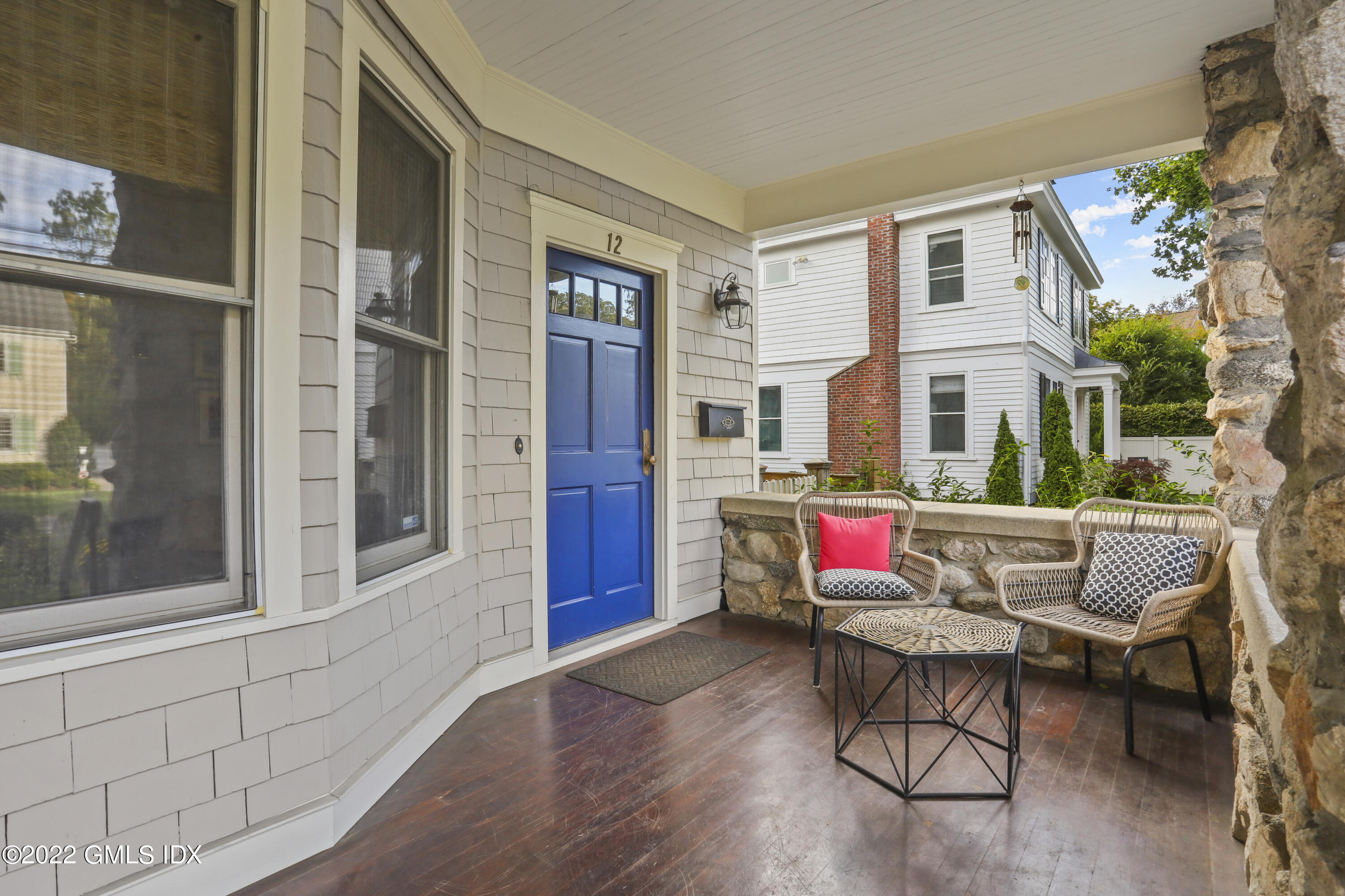 12 Maher Avenue Greenwich, CT 06830 - Photo 28 of 34 a building outdoor space with patio furniture and potted plants