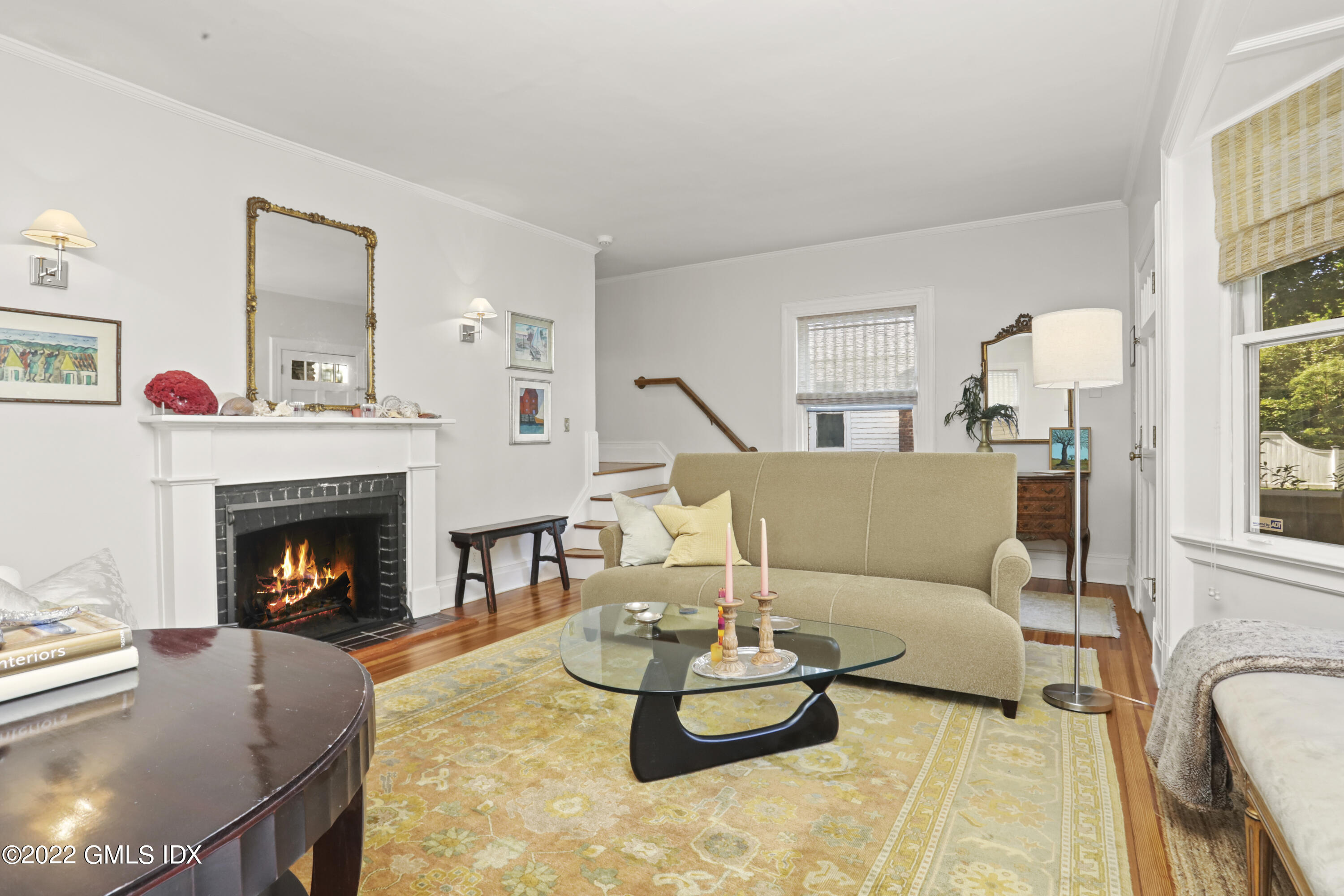 12 Maher Avenue Greenwich, CT 06830 - Photo 3 of 34 a living room with furniture and a fireplace