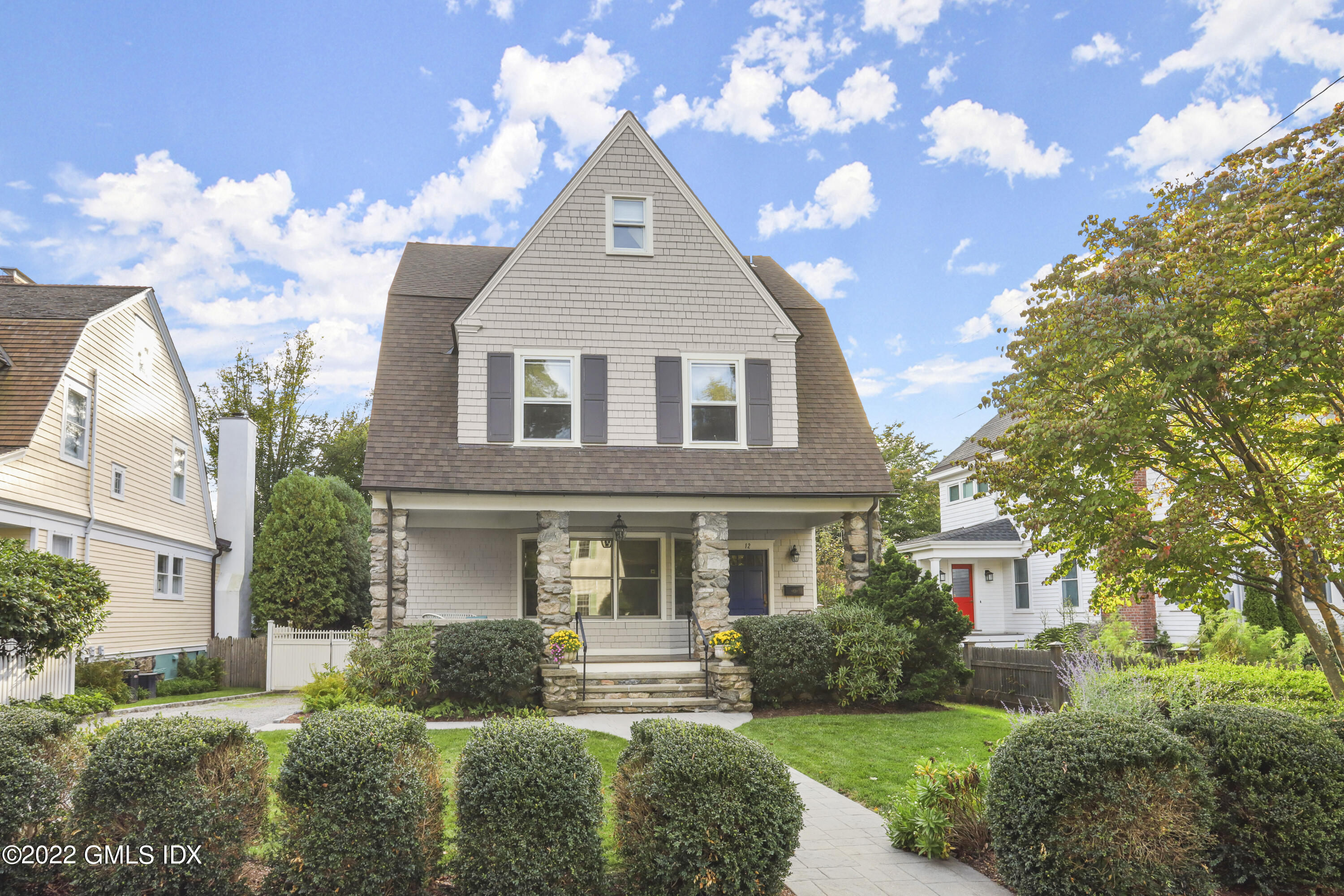 12 Maher Avenue Greenwich, CT 06830 - Photo 31 of 34 a front view of a house with a yard