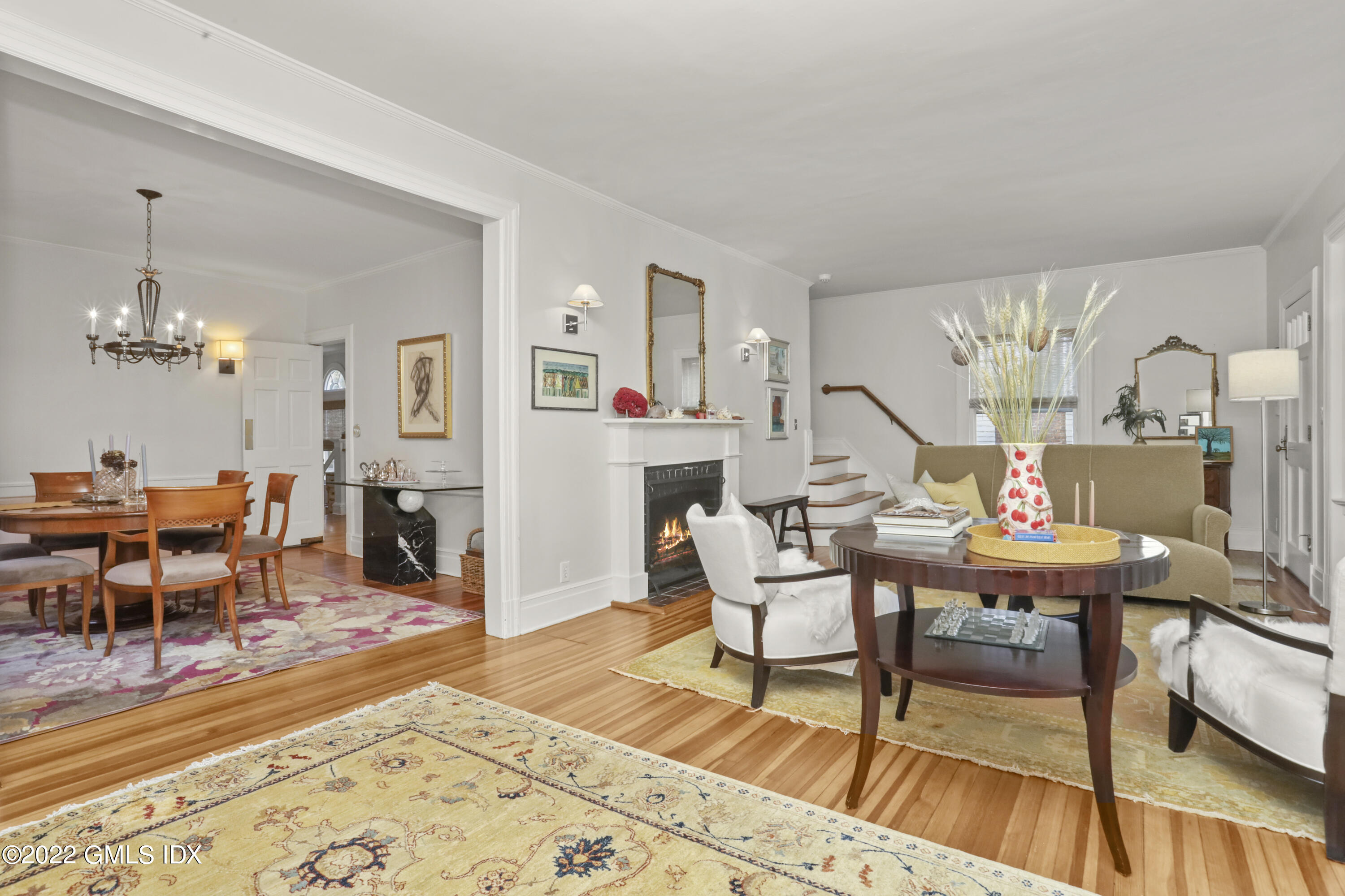 12 Maher Avenue Greenwich, CT 06830 - Photo 4 of 34 a living room with furniture a rug and a dining table