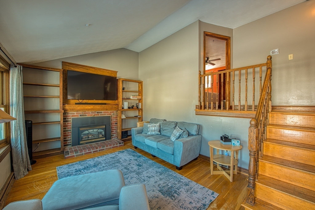12 Brewster Road Randolph, MA 02368 - Photo 3 of 27 a living room with furniture and a fireplace