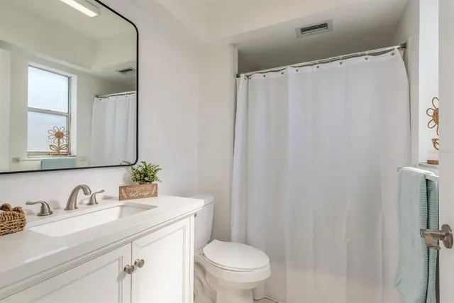 a view of a livingroom with furniture and windows