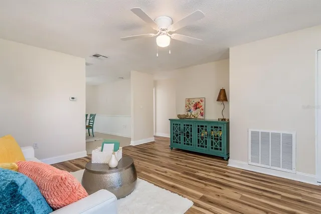 a living room with furniture and a table