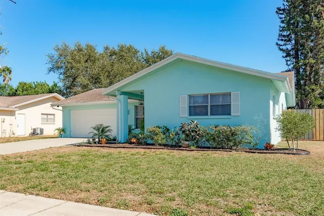 a view of a porch with furniture and garden