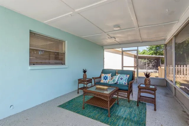 a living room filled with furniture and a garden
