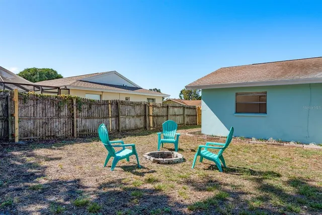 a view of a backyard with a trees