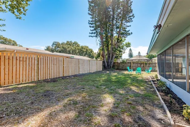 a view of a house with backyard porch and sitting area
