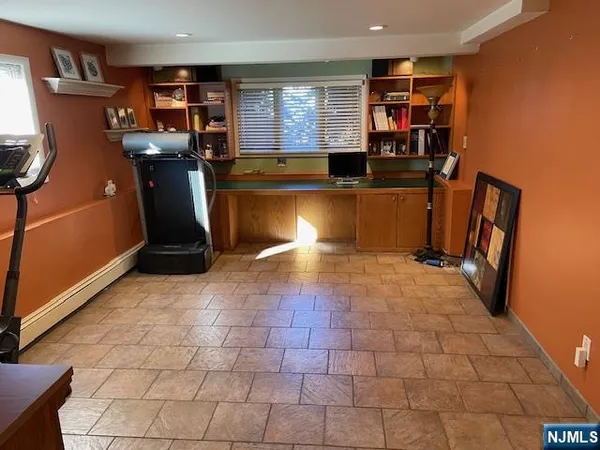 a view of a kitchen with furniture and a window