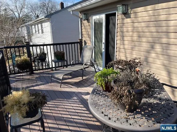 a view of a chairs and table on the deck