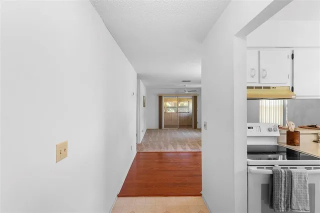 a view of a kitchen from the hallway