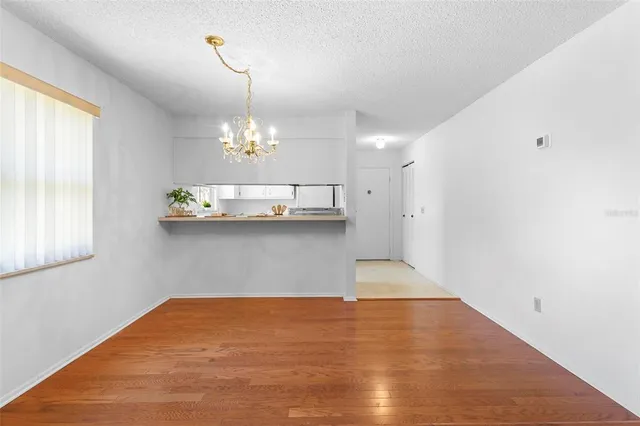 a view of a room with window and wooden floor