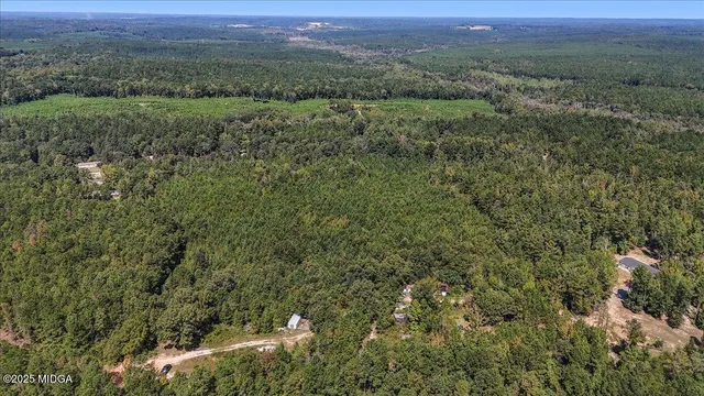 a view of a big yard with houses