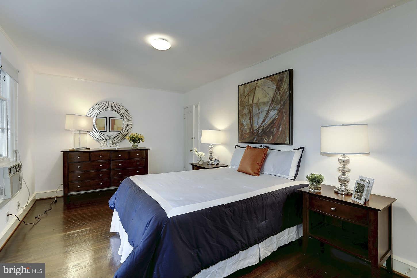 3707 Reservoir Road Northwest Washington, DC 20007 - Photo 11 of 19 a bedroom with a bed and a dresser