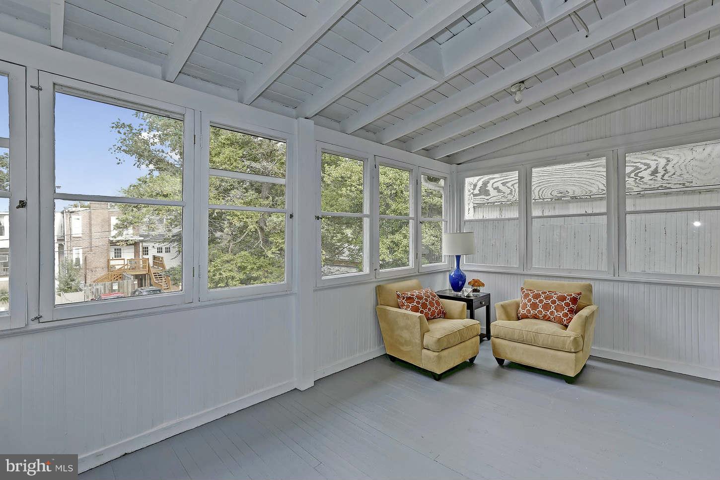 3707 Reservoir Road Northwest Washington, DC 20007 - Photo 12 of 19 a living room with furniture and a large window