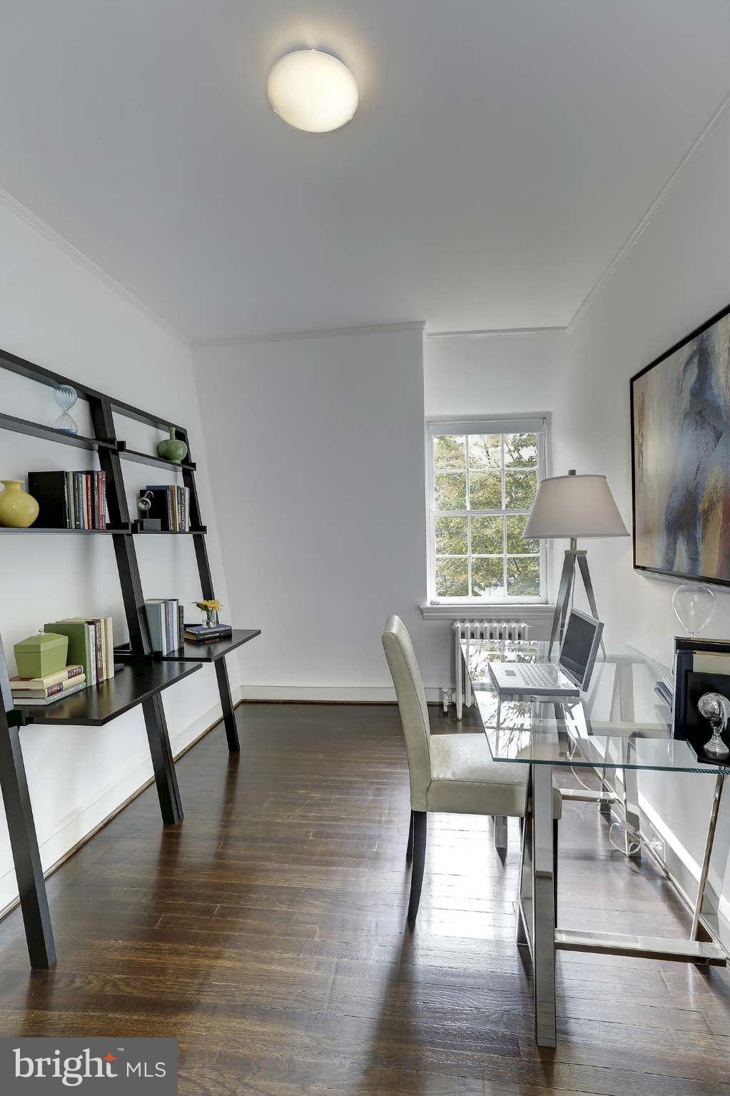 3707 Reservoir Road Northwest Washington, DC 20007 - Photo 16 of 19 a dining room with furniture and wooden floor
