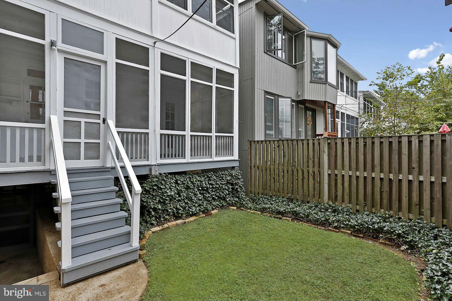 3707 Reservoir Road Northwest Washington, DC 20007 - Photo 18 of 19 a view of a house with a small yard and wooden fence